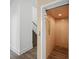 Modern home elevator with wood-like flooring and conveniently located near the stairs at 72 N School Ave, Sarasota, FL 34237