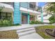 Modern townhouse exterior with teal accents and landscaping at 72 N School Ave, Sarasota, FL 34237