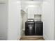 Convenient laundry room with washer, dryer, and cabinets at 72 N School Ave, Sarasota, FL 34237