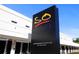 Black sign for Sarasota Orchestra with building in background at 72 N School Ave, Sarasota, FL 34237