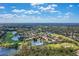 Community overview, showcasing homes, golf course, and lakes at 7244 Orchid Island Pl, Bradenton, FL 34202