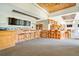 Upscale bar with wooden finishes and barstools at 7244 Orchid Island Pl, Bradenton, FL 34202