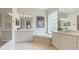 Spa-like bathroom with double vanities and soaking tub at 7244 Orchid Island Pl, Bradenton, FL 34202