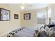 Bedroom with double windows, ceiling fan, and baseball memorabilia at 7244 Orchid Island Pl, Bradenton, FL 34202