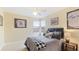 Bedroom with double windows, ceiling fan, and baseball memorabilia at 7244 Orchid Island Pl, Bradenton, FL 34202