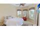 Guest bedroom with queen-size bed and ceiling fan at 7244 Orchid Island Pl, Bradenton, FL 34202