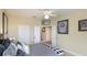 Bedroom with double windows, ceiling fan, and baseball memorabilia at 7244 Orchid Island Pl, Bradenton, FL 34202