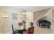 Elegant dining room with glass table, piano, and tasteful decor at 7244 Orchid Island Pl, Bradenton, FL 34202