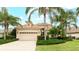 One-story home with tile roof and palm trees at 7244 Orchid Island Pl, Bradenton, FL 34202
