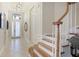 Bright foyer with staircase and tile floors at 7244 Orchid Island Pl, Bradenton, FL 34202