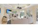 Gathering room with built-in shelving and access to the pool area at 7244 Orchid Island Pl, Bradenton, FL 34202
