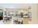 Modern kitchen with stainless steel appliances and breakfast bar at 7244 Orchid Island Pl, Bradenton, FL 34202