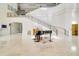 Elegant lobby with grand staircase and piano at 7244 Orchid Island Pl, Bradenton, FL 34202