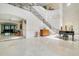 Spacious lobby with a grand staircase at 7244 Orchid Island Pl, Bradenton, FL 34202