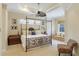 Spacious main bedroom with king-size bed and sitting area at 7244 Orchid Island Pl, Bradenton, FL 34202