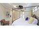 Main bedroom with king-size bed and access to bathroom at 7244 Orchid Island Pl, Bradenton, FL 34202
