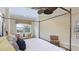 Main bedroom with king-size bed, sitting area, and view at 7244 Orchid Island Pl, Bradenton, FL 34202