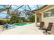Screened pool with fountain and patio seating at 7244 Orchid Island Pl, Bradenton, FL 34202