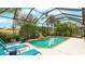 Inviting screened pool area with lounge chairs at 7244 Orchid Island Pl, Bradenton, FL 34202