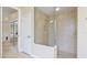 Walk-in shower with glass enclosure and tile surround at 7244 Orchid Island Pl, Bradenton, FL 34202
