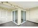 Covered balcony with string lights and access to storage at 7304 W Country Club N Dr # 213, Sarasota, FL 34243