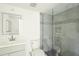 Modern bathroom with gray tile and a glass shower at 7304 W Country Club N Dr # 213, Sarasota, FL 34243