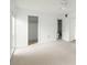 Bright bedroom with carpet, large window, and walk-in closet at 7304 W Country Club N Dr # 213, Sarasota, FL 34243