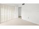 Bedroom with large closet and access to hallway at 7304 W Country Club N Dr # 213, Sarasota, FL 34243