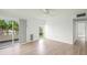 Spacious bedroom with wood-look floors and sliding glass doors at 7304 W Country Club N Dr # 213, Sarasota, FL 34243