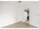 Simple dining area with wood flooring and kitchen access at 7304 W Country Club N Dr # 213, Sarasota, FL 34243