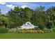 Palm Aire Country Club entrance with lush landscaping at 7304 W Country Club N Dr # 213, Sarasota, FL 34243