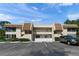 Front view of condo building, with parking and landscaping at 7304 W Country Club N Dr # 213, Sarasota, FL 34243
