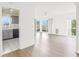 Open living space with kitchen and balcony views at 7304 W Country Club N Dr # 213, Sarasota, FL 34243