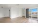 Living room with balcony access and wood flooring at 7304 W Country Club N Dr # 213, Sarasota, FL 34243