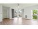 Living room with sliding doors to balcony and hardwood floors at 7304 W Country Club N Dr # 213, Sarasota, FL 34243