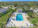 Community pool with surrounding patio and lounge chairs at 7304 W Country Club N Dr # 213, Sarasota, FL 34243