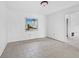 Spacious room with tile floor, ready for customization at 740 Old Compass Rd, Longboat Key, FL 34228