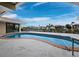 Kidney shaped pool with patio and water views at 740 Old Compass Rd, Longboat Key, FL 34228