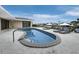 Relaxing kidney-shaped pool with lounge chairs and waterfront views at 740 Old Compass Rd, Longboat Key, FL 34228