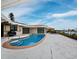 Relaxing pool and spa area with patio, offering serene water views at 740 Old Compass Rd, Longboat Key, FL 34228