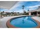 Relaxing kidney-shaped pool with canal view at 740 Old Compass Rd, Longboat Key, FL 34228