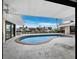 Kidney-shaped pool with covered patio and waterfront views at 740 Old Compass Rd, Longboat Key, FL 34228