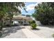 Relaxing patio area with tables and chairs, perfect for outdoor dining at 7429 Sanderling Rd, Sarasota, FL 34242