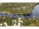 Aerial view of a peaceful waterfront community with kayaks and lush nature at 7728 Rio Bella Pl, Bradenton, FL 34201