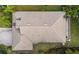 Aerial view showing home's roofline, landscaping, and backyard at 7728 Rio Bella Pl, Bradenton, FL 34201