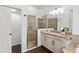 Bathroom with walk-in shower and granite countertop at 7728 Rio Bella Pl, Bradenton, FL 34201