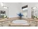 Elegant Primary bathroom with soaking tub and double vanity at 7728 Rio Bella Pl, Bradenton, FL 34201