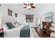 Spacious Primary bedroom with large TV and wood floors at 7728 Rio Bella Pl, Bradenton, FL 34201