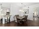 Elegant dining room with a rustic wooden table and six chairs at 7728 Rio Bella Pl, Bradenton, FL 34201