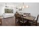 Dining room with dark wood table and chairs, and hardwood floors at 7728 Rio Bella Pl, Bradenton, FL 34201